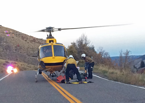 Firefighters prepare their gear to fly into Blacksmith Fork Canyon to fight Friday’s fire. (Erin West photo)