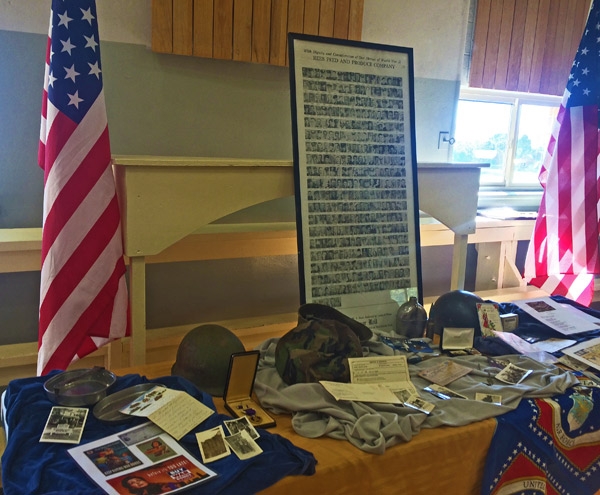 SMITHFIELD’s SERVICE — Displays honoring the town’s veterans included canteens and mess kits, medals, photos and other war memorabilia. (Rebecca Wheatley photo)