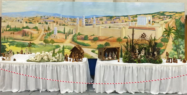 JERUSALEM COMES TO TOWN — Edna Berg’s mural of ancient Jerusalem was the backdrop for last week’s Nativities of the World exhibit. (Rebecca Wheatley photo)